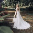 Bride Wearing Lace Aline Bridal Gown Called Harlem By Maggie Sottero In A Garden
