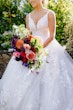 Bride with Bouquet at Fall Wedding Wearing Wedding Gown Called Valona by Sottero and Midgley.