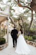 Bride Wearing A-line Bridal Dress Ainsleigh By Rebecca Ingram Holding Hands And Walking Away With Groom