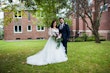 Groom With Bride Wearing Long Sleeve Ball Gown Wedding Dress With A Tiered Organza Skirt Tessa By Rebecca Ingram