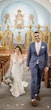 Groom and Bride Wearing Beaded Lace Off-the-Shoulder Wedding Gown Called Elias by Sottero and Midgley