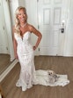 Bride Wearing Lace Mermaid Wedding Dress Called Bronson By Sottero And Midgley With Dog Sitting On Her Train