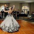 Bride wearing Tristyn wedding dress by Maggie Sottero dancing with her husband