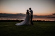 Groom With Bride Wearing A-Line Lace Wedding Dress Marisol By Rebecca Ingram