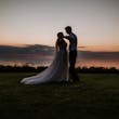 Groom With Bride Wearing A-Line Lace Wedding Dress Marisol By Rebecca Ingram