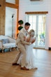 Bride wearing Albany wedding dress by Maggie Sottero dancing with her husband