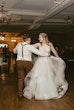 Bride Wearing Asymmetrical Wedding Gown Winona By Rebecca Ingram