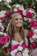 Bride Wearing Sparkly Ballgown Wedding Dress Called Shasta By Sottero And Midgley With Pink And White Rose Bouquets Surrounding Her