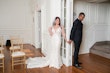 Bride wearing Bailey by Sottero and Midgley holding hands with her husband