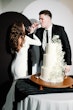 Bride wearing Fernanda wedding dress by Maggie Sottero drinking champaign with her husband