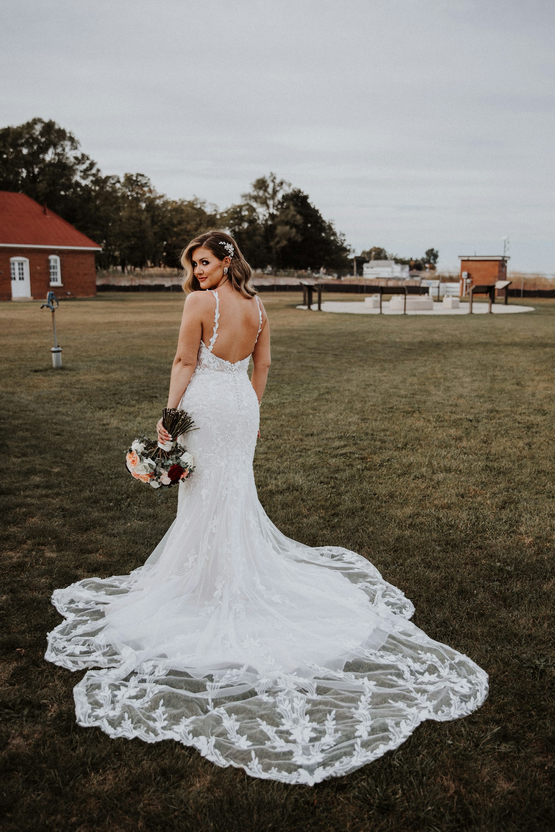 Bride Wearing Beaded Fit-n-flare Wedding Dress Called Jonah Lane By Sottero And Midgley On A Farm