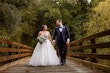 Bride Wearing Sparkly Princess Wedding Dress Called Elton By Sottero And Midgley With Groom On A Bridge