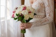 Bride Wearing Boho Sleeved Wedding Dress Called Drita By Maggie Sottero Holding Bouquet