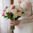 Bride Wearing Boho Sleeved Wedding Dress Called Drita By Maggie Sottero Holding Bouquet