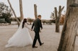 Groom And Bride Walking Together. Bride Wearing Lace Ball Gown Called Mallory Dawn By Maggie Sottero