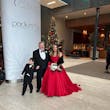 Bride Wearing Red Aline Wedding Dress Called Scarlet By Maggie Sottero Next To A Christmas Tree And Groom And Child