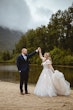 Bride Wearing Lace Aline Wedding Dress Called Harlem By Maggie Sottero Dancing With Groom On A Beach