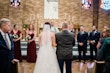 Bride Wearing Ballerina-inspired Romantic Wedding Dress Called Fairbanks By Maggie Sottero And Groom At The Ceremony