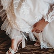 Bride wearing A-line long sleeve lace wedding dress.