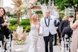 Bride Wearing Lace Mermaid Wedding Dress Called Bronson By Sottero And Midgley Holding Hands With Groom Walking Down The Aisle