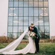 Bride Wearing Sexy Lace Wedding Dress Called Fiona By Maggie Sottero Next To A Large Window
