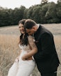 Groom Kissing Bride In Lacey Illusion Wedding Dress Named Angie By Rebecca Ingram