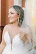 Bride wearing Hattie Lane Marie wedding dress by Rebecca Ingram