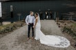 Groom Looking At Bride In White Wedding Dress Named Sadie By Rebecca Ingram