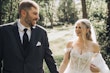 Bride Wearing Lace Aline Bridal Gown Called Harlem By Maggie Sottero Smiling At Groom