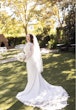 Real Bride In A White Long Sleeve Wedding Dress Named Nikki By Maggie Sottero With Veil And Flowers