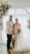 Bride wearing Indiana by Maggie Sottero with her husband and dog