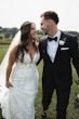 Bride wearing Tuscany Royale by Maggie Sottero with her husband