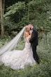 Bride wearing Hattie Lynette by Rebecca Ingram embracing her husband