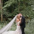 Bride wearing Hattie Lynette by Rebecca Ingram embracing her husband
