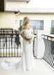 Bride Wearing Pearl Sparkly Bridal Gown Called Drew By Maggie Sottero On A Balcony