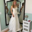 Bride posing in wedding dress called Vernice