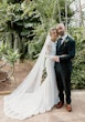 Bride wearing Bethany wedding dress by Rebecca Ingram with her husband