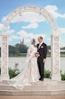 Bride Wearing Lace A-Line Wedding Dress Called Tuscany Lane By Maggie Sottero With Groom At Disneyland