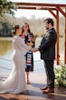 Groom at Altar with Bride in Geometric Allover Lace Wedding Dress with Sweetheart Neckline Called Dover by Maggie Sottero