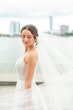 Bride wearing Marvine wedding gown by Sottero and Midgley 