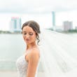 Bride wearing Marvine wedding gown by Sottero and Midgley