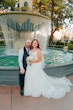 Groom and Bride at a Las Vegas Wedding Wearing Lace Ballgown Called Ellen by Rebecca Ingram