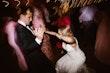 Groom Dancing with Bride in Vintage Inspired Puff Sleeve Mermaid Wedding Dress in 3-D Floral Motifs Called Cruz by Sottero & Midgley