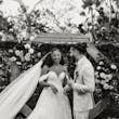 Bride wearing Lettie by Rebecca Ingram laughing with her husband