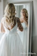 Bride Wearing Aline Satin Wedding Gown Called Scarlet By Maggie Sottero Looking In A Mirror