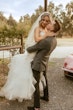 Groom Kissing Bride Wearing Pink Lace Mermaid Wedding Dress Called Kenleigh By Sottero And Midgley