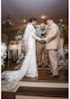 Bride Wearing Modest Lace Wedding Dress Called Tuscany Leigh By Maggie Sottero With Groom Getting Married