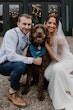 Groom Posing With Bride In White Wedding Dress Named Sadie By Rebecca Ingram With Their Dog