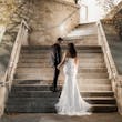 Groom Holding Hands with Bride in Opulent Stretch Satin Vintage Sheath Wedding Dress with Scoop Back called Yates by Maggie Sottero