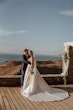 Bride wearing Aspen by Sottero and Midgley being embraced by her husband